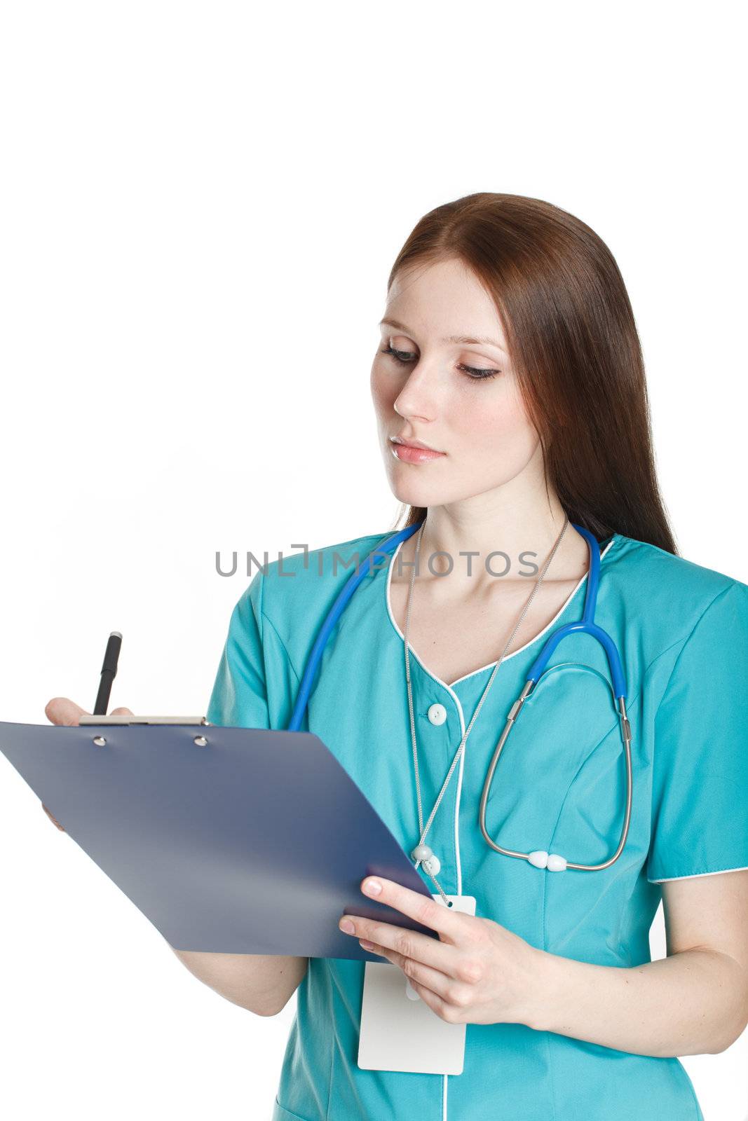 The young female doctor writing a diagnosis.