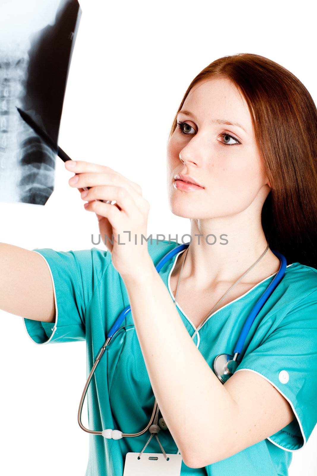 Pretty female doctor looking at xray picture