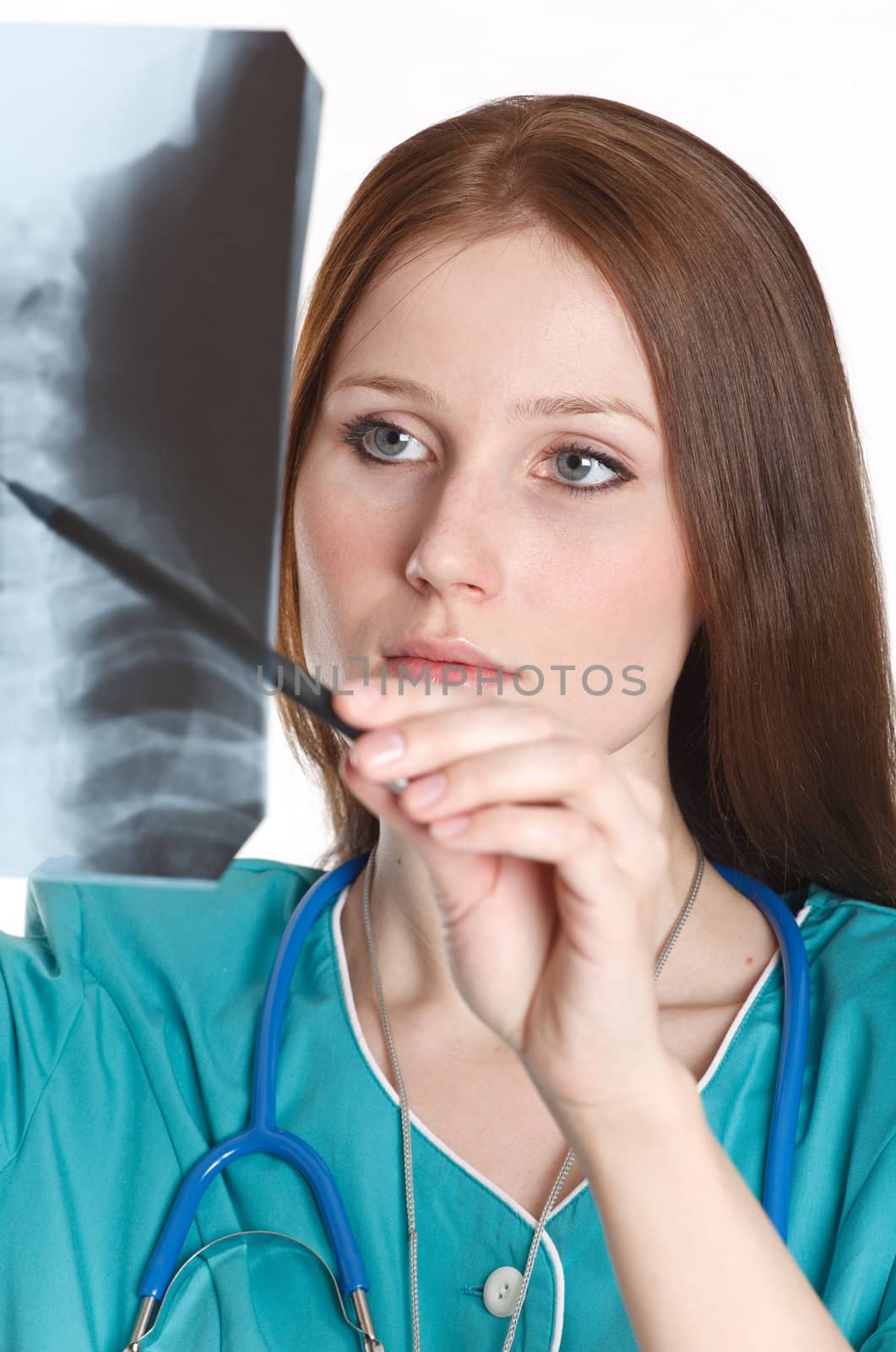 Female doctor looking at the xray picture by Nobilior