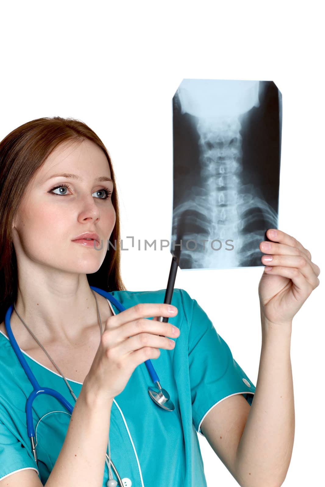 Young female doctor looking at the xray picture