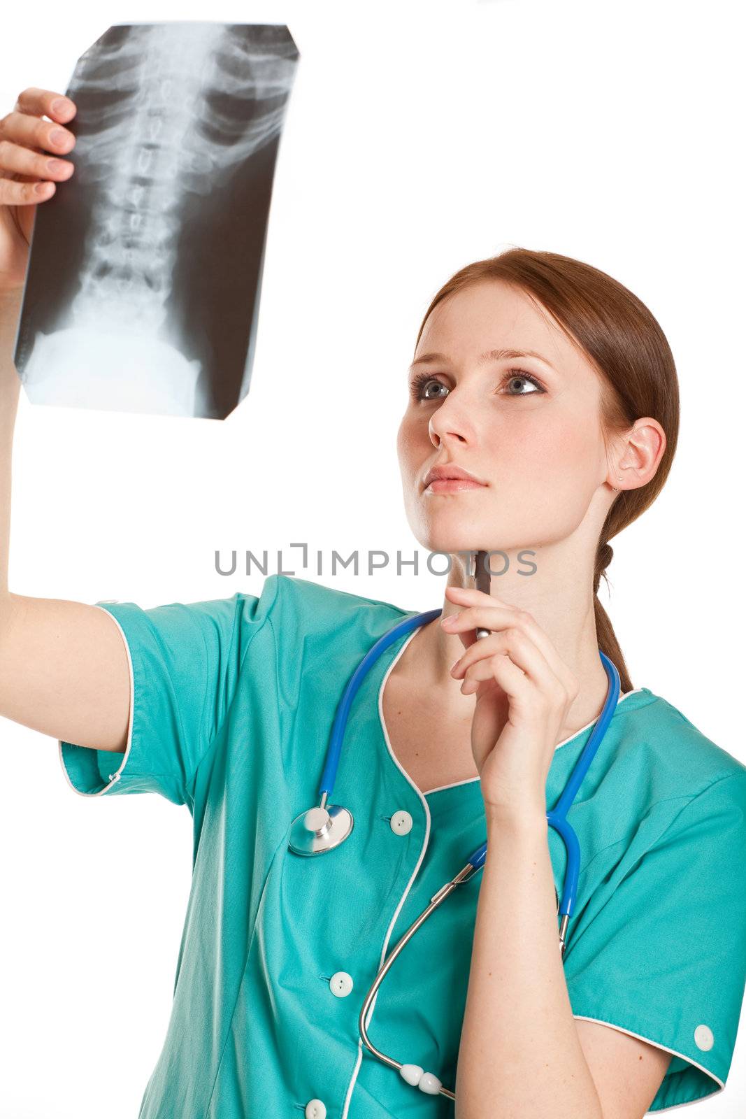 Female doctor looking at the xray picture by Nobilior