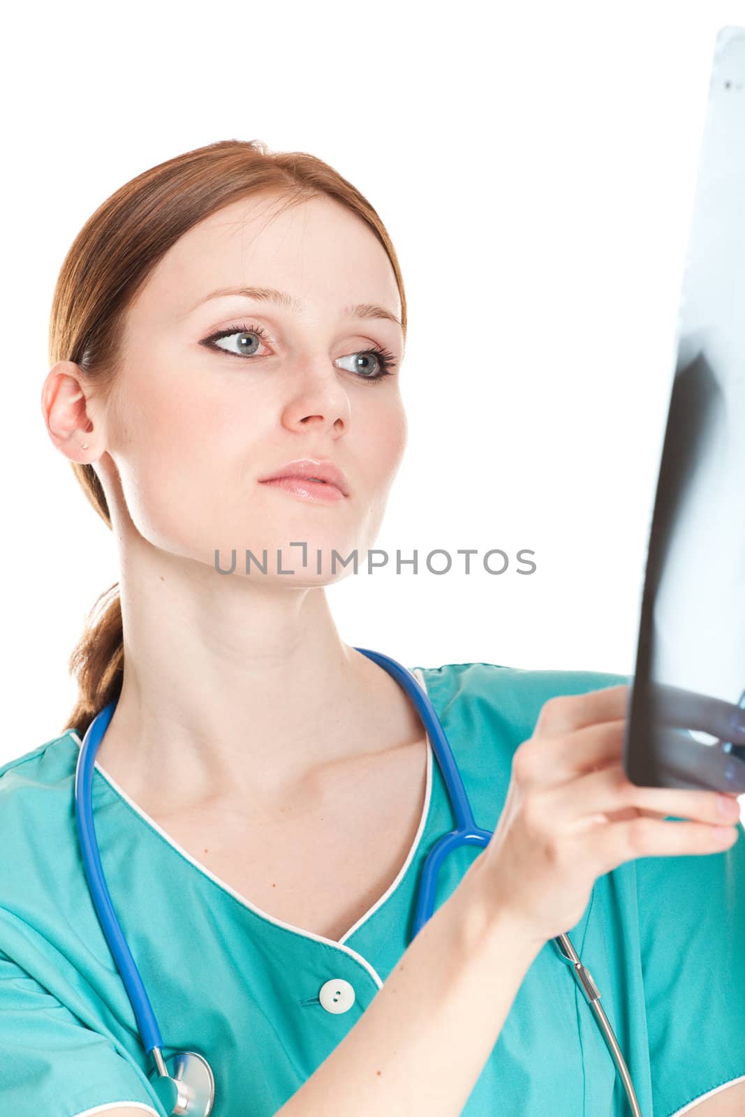 Female doctor looking at xray picture by Nobilior