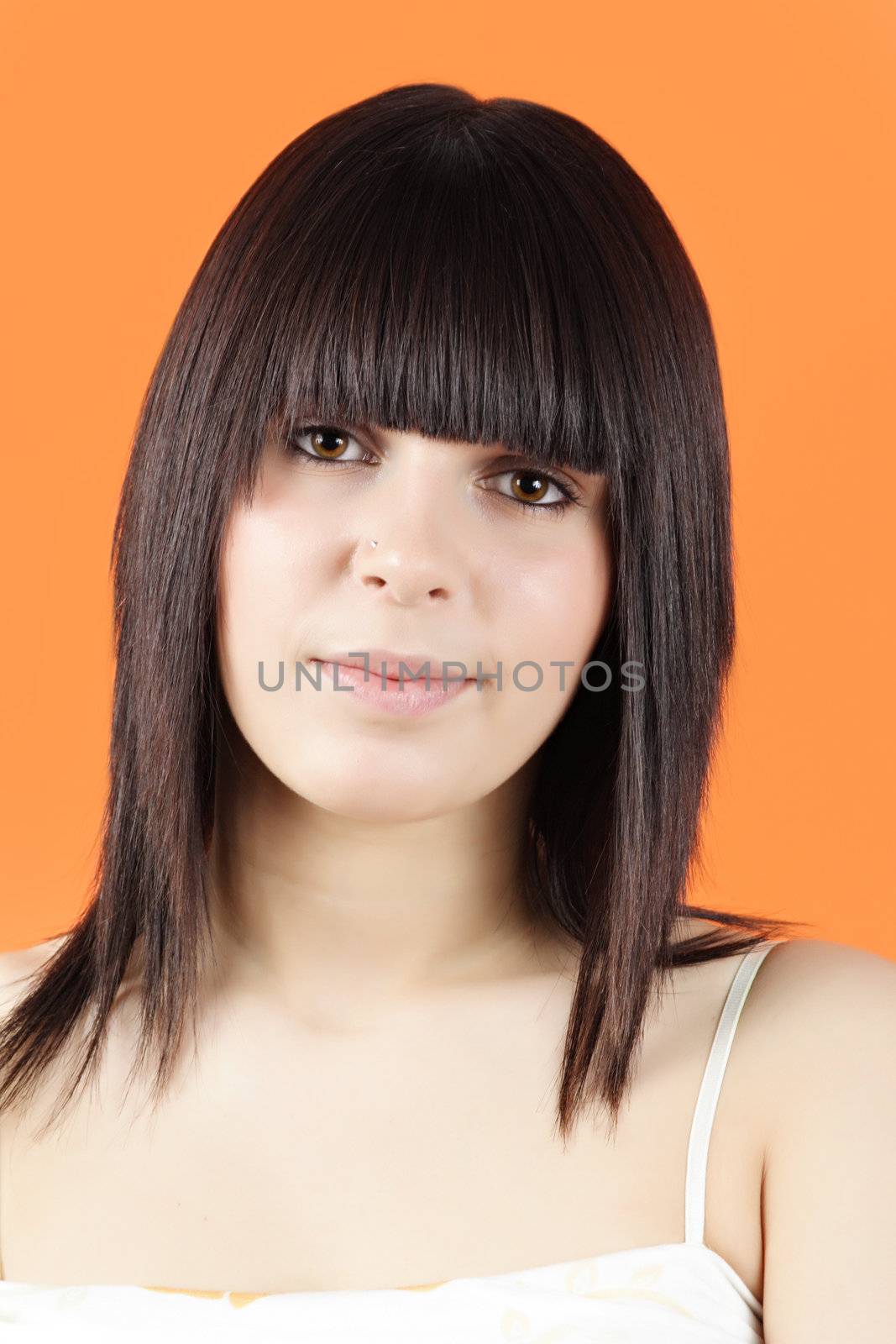 portrait of pretty teen girl, orange background