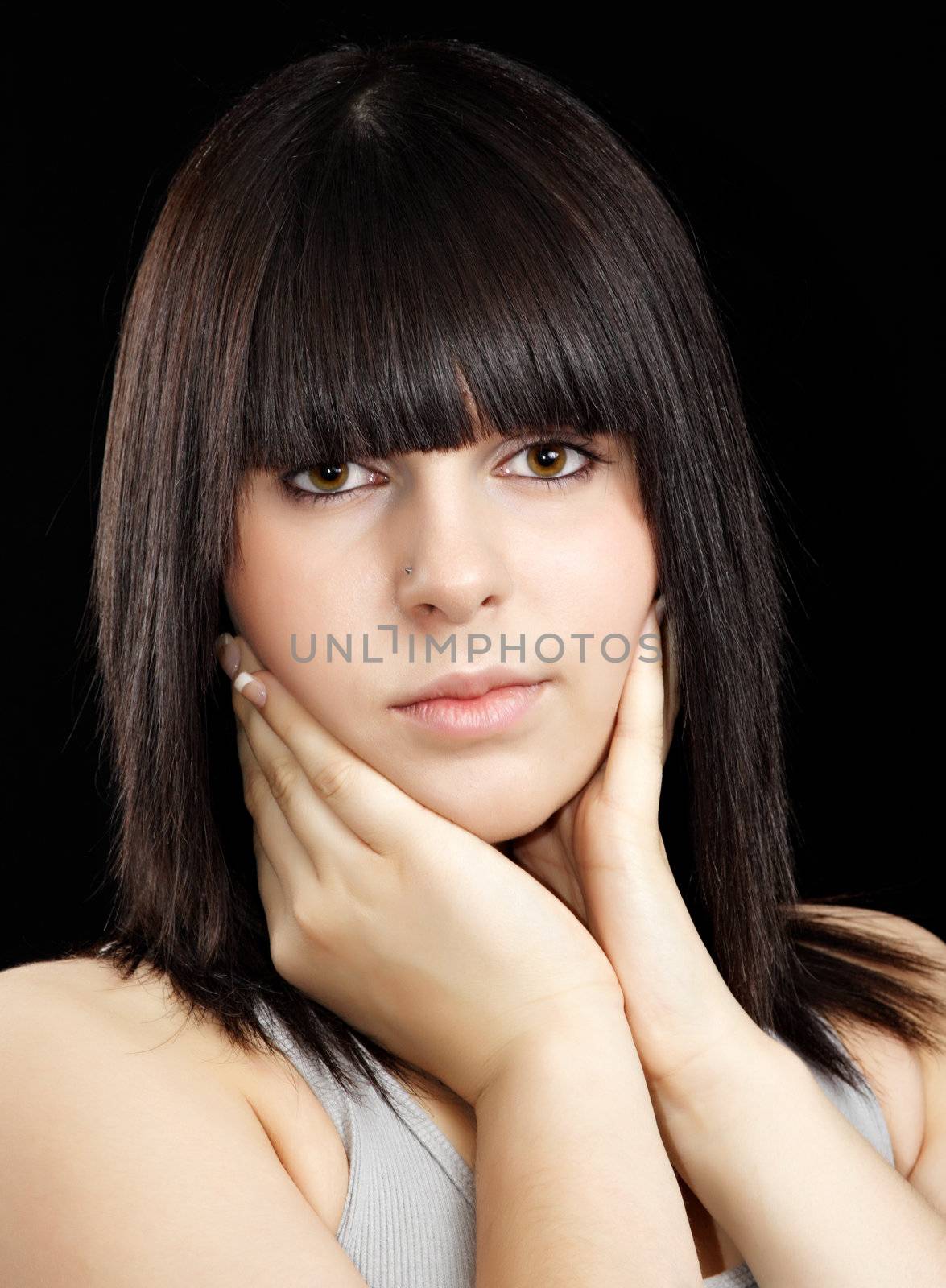 portrait of pretty teen girl, black background