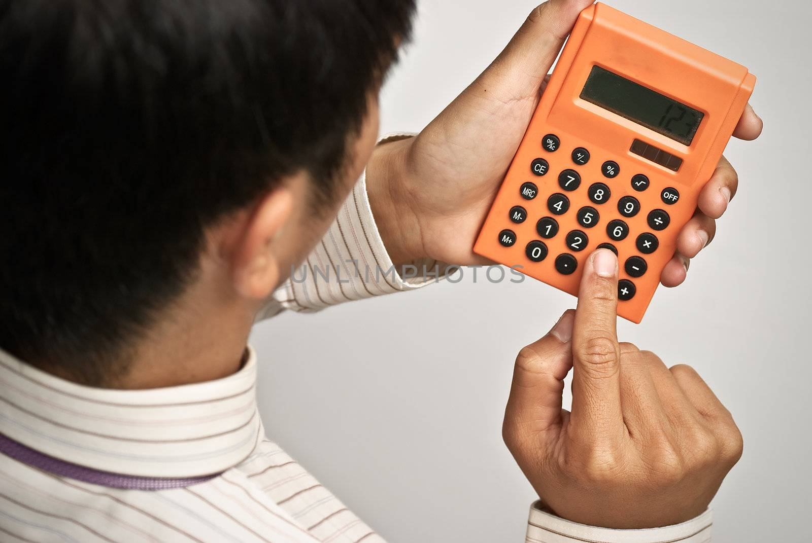 Calculator on businessman's hand, business concept of finance .