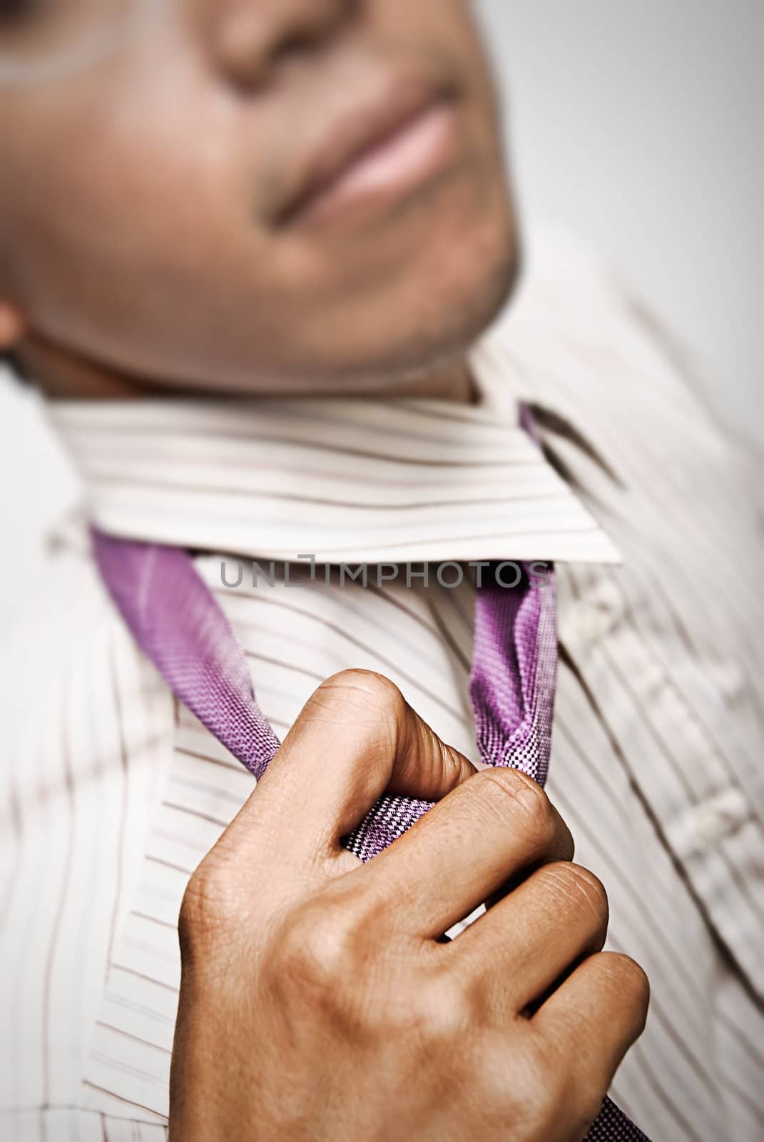 Businessman untie the tie for rest,closeup and focus on tie.