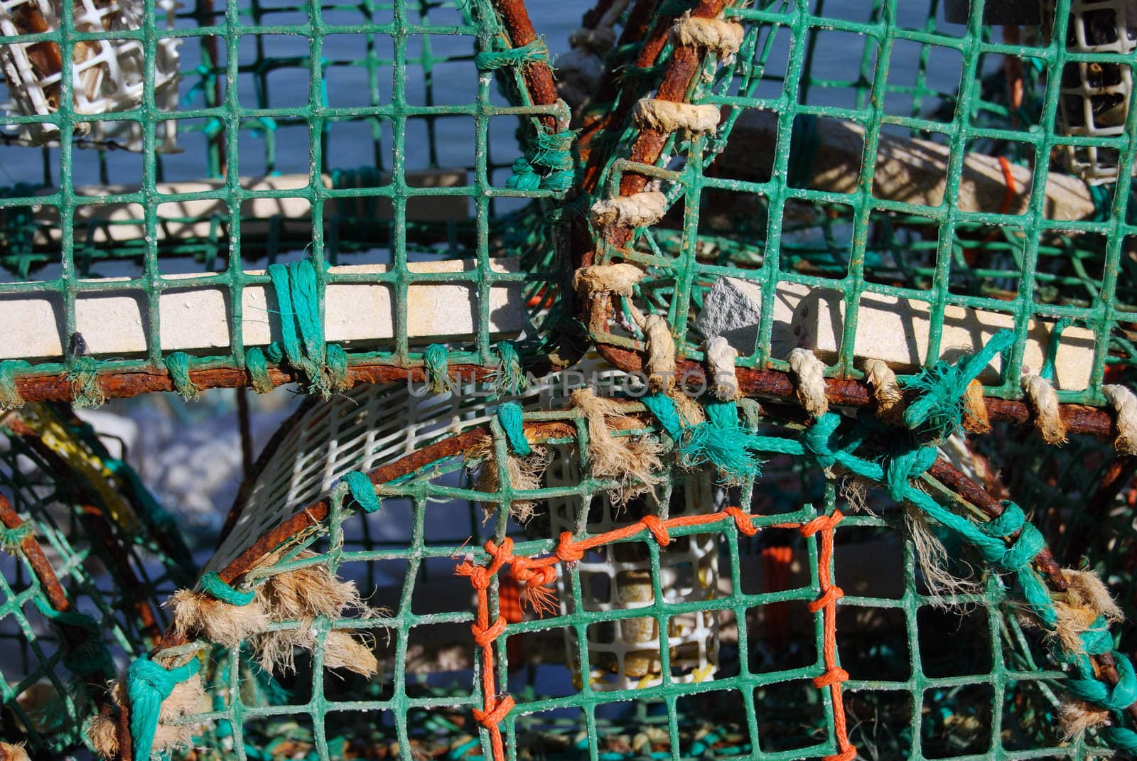 closeup of fishing nets lying in a harbor