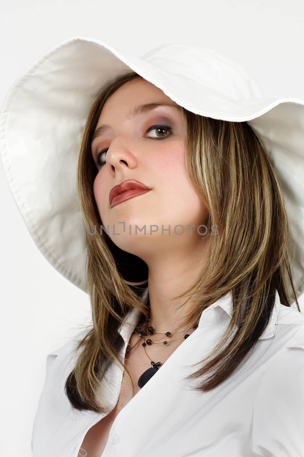 portrait of a woman wearing white hat