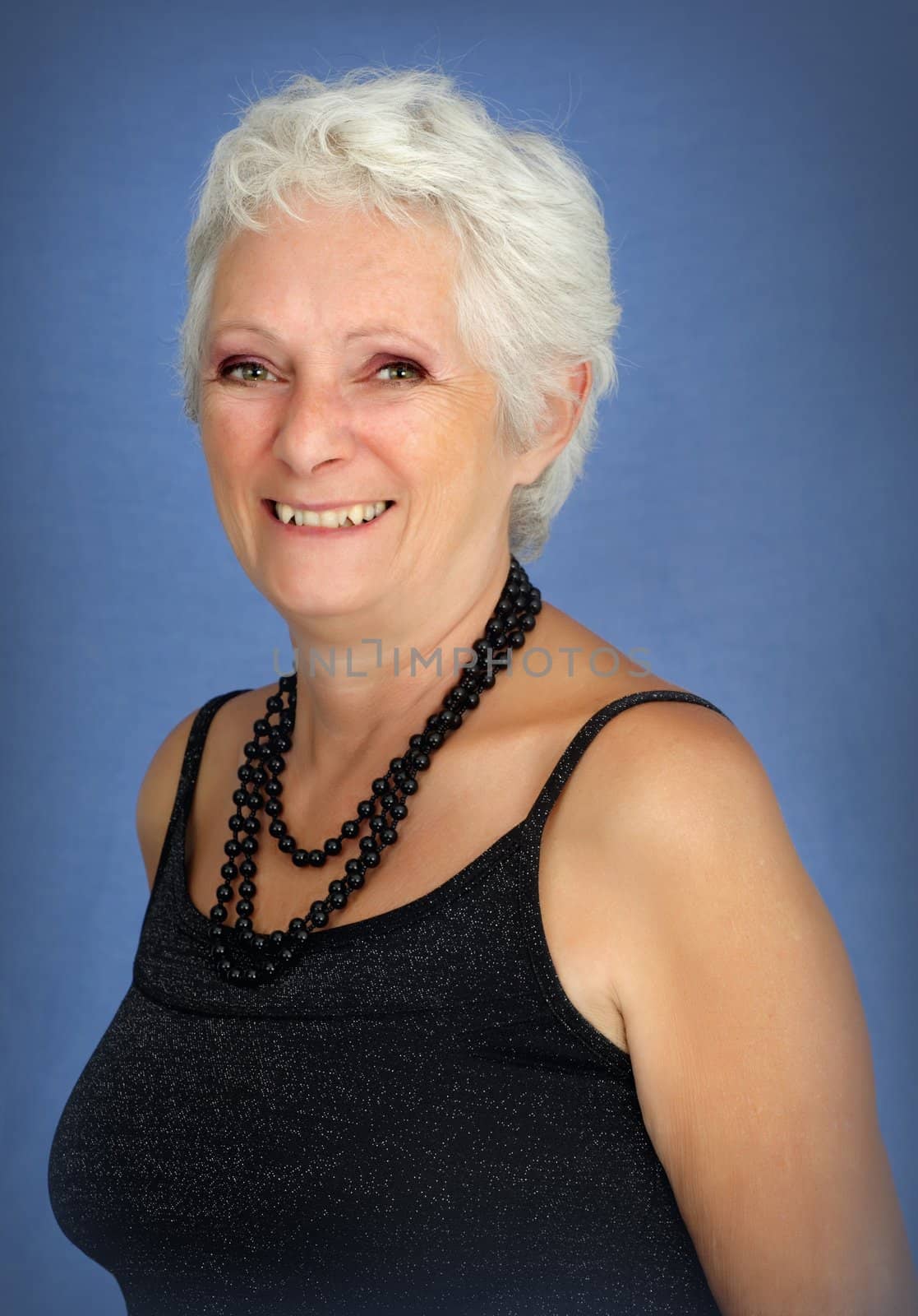 Happy smiling mature woman with white hair