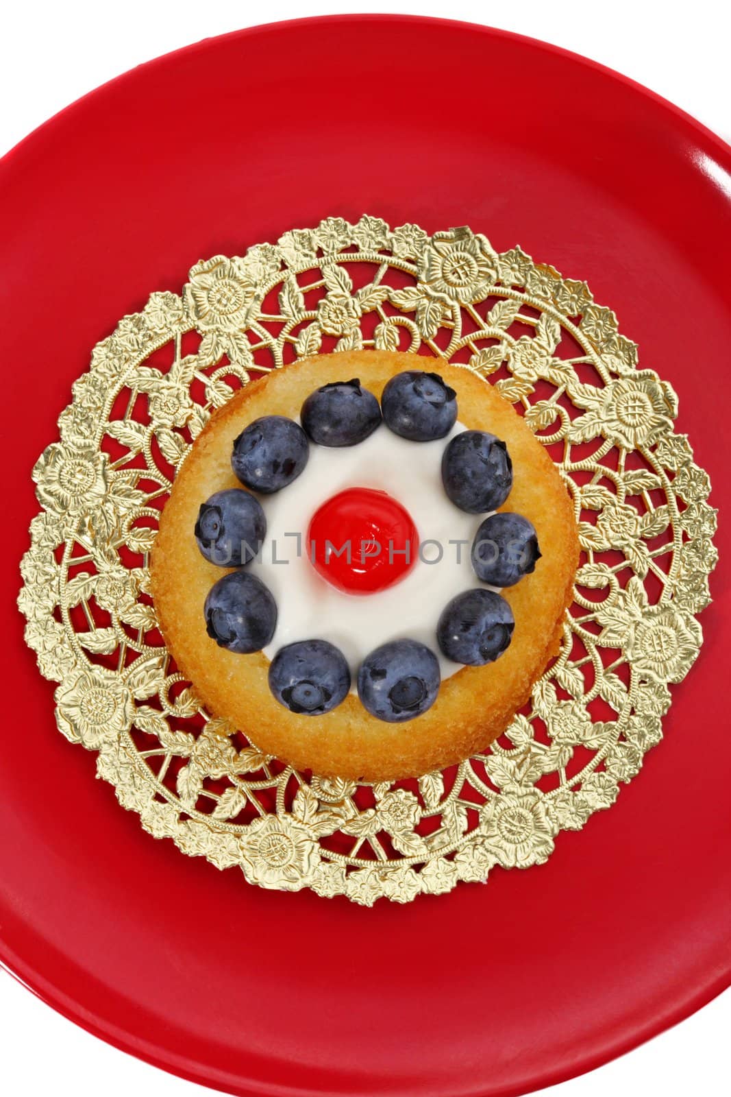 blueberry and cherry shortcake on red plate
