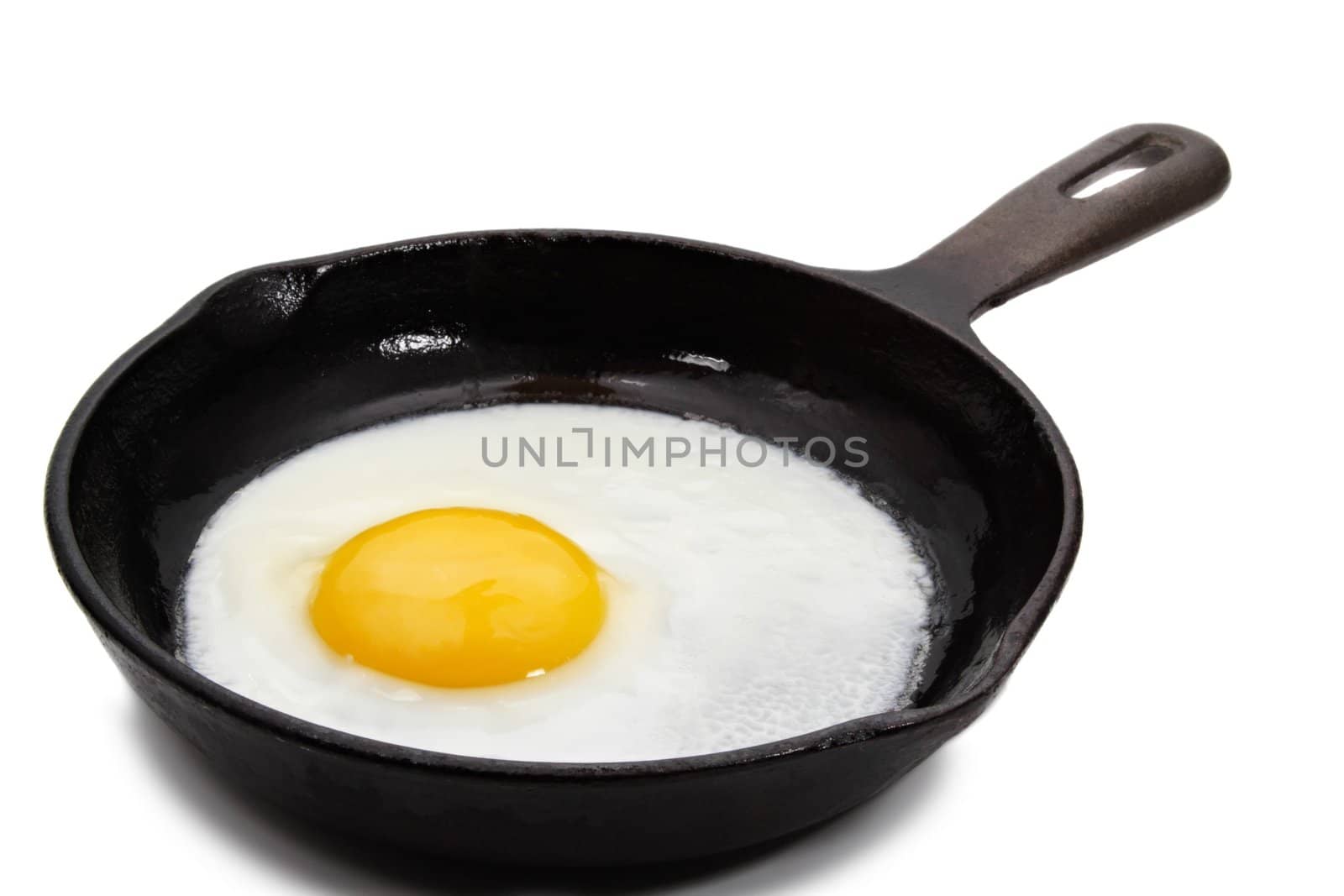 sunny side-up egg on a black cast iron pan