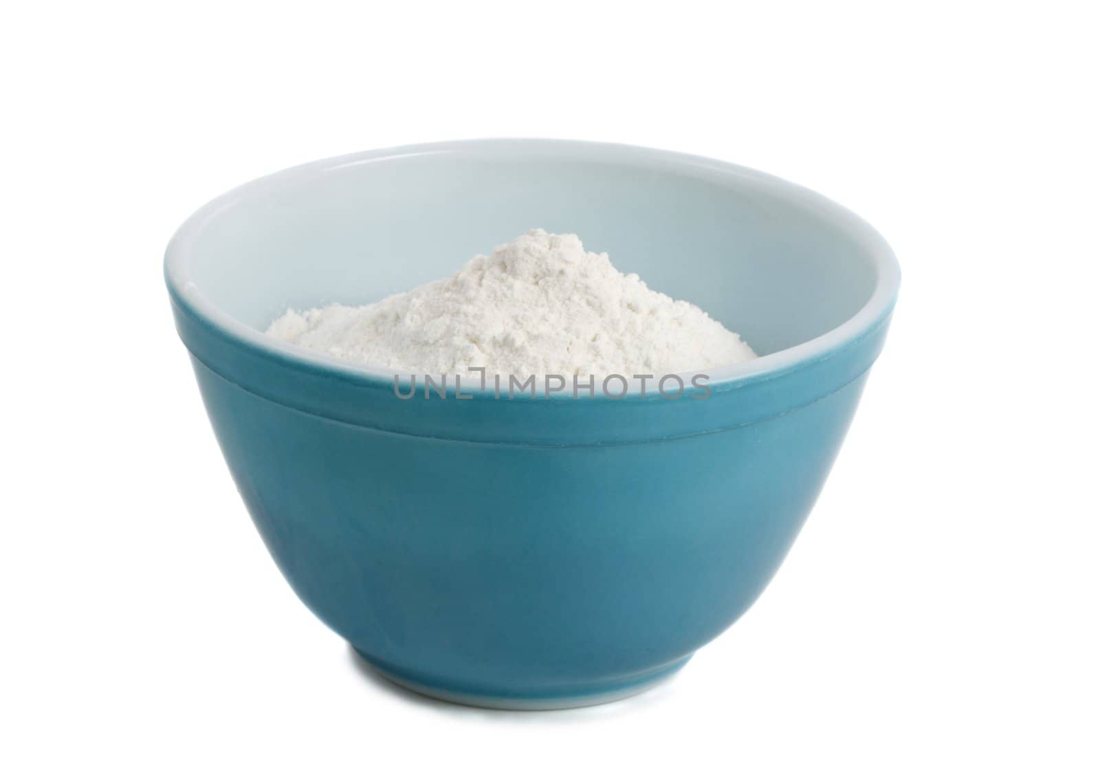 blue bowl filled with white flour, isolated on white