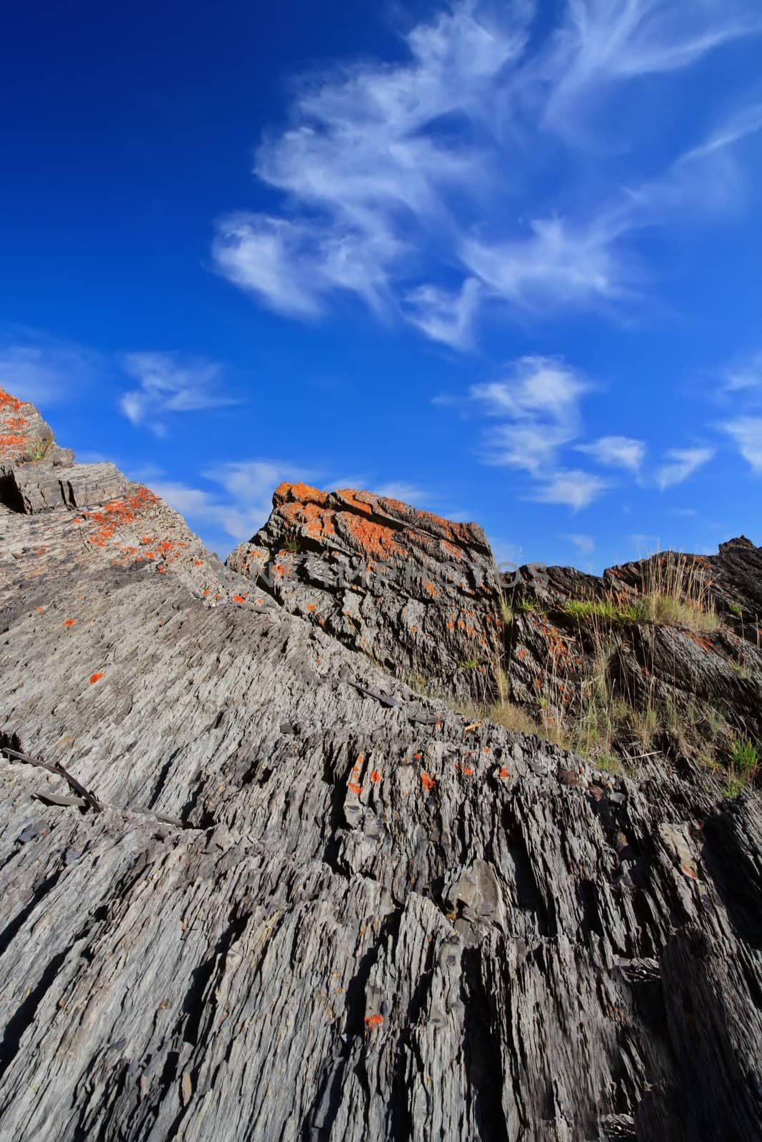 vertical landscape with rock and blue sky