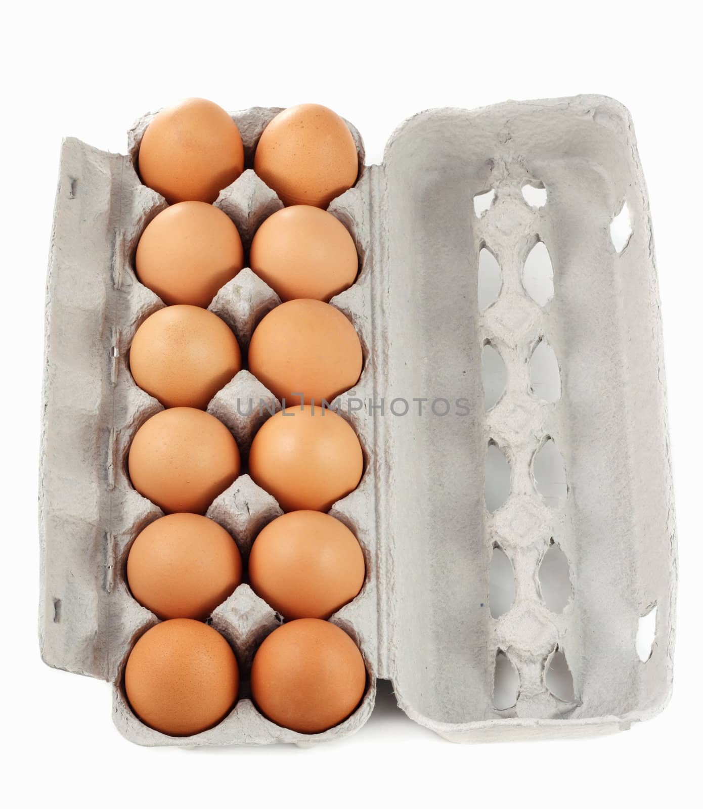 dozen of fresh brown eggs on container