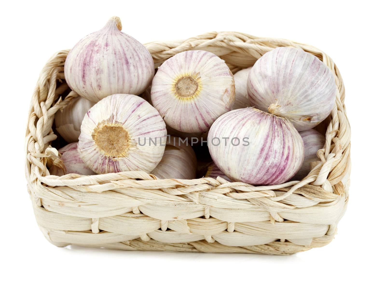 garlic bulb on basket, white background