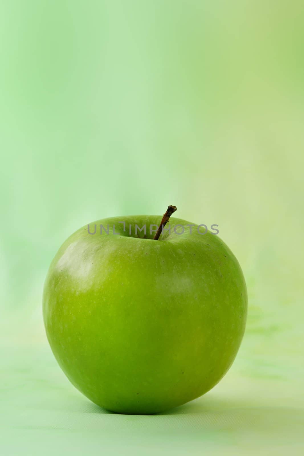 granny smith apple, green background
