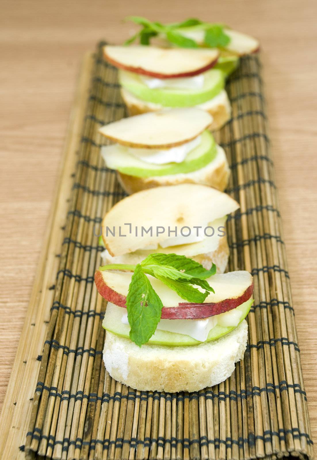 delicious and fresh appetizer row, white cheese and apple