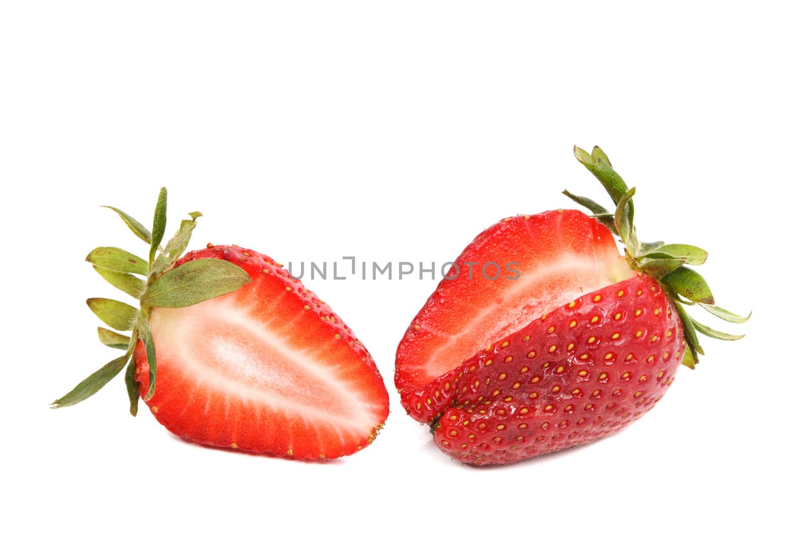 two cutted stawberries isolated on white