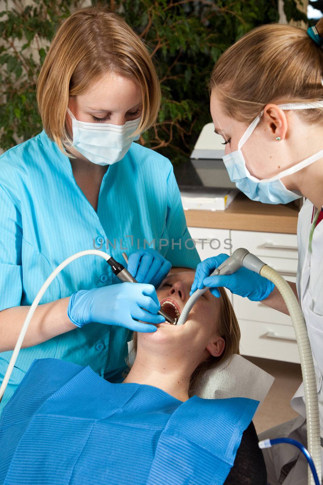 Patient in the chair of the dentist being treated