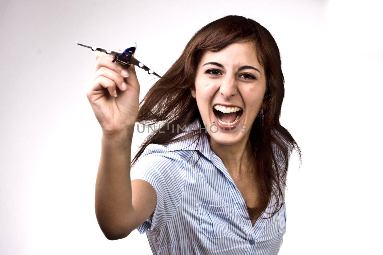 Photo Of A Cheerful Woman Launching A Miniature Plane Model
