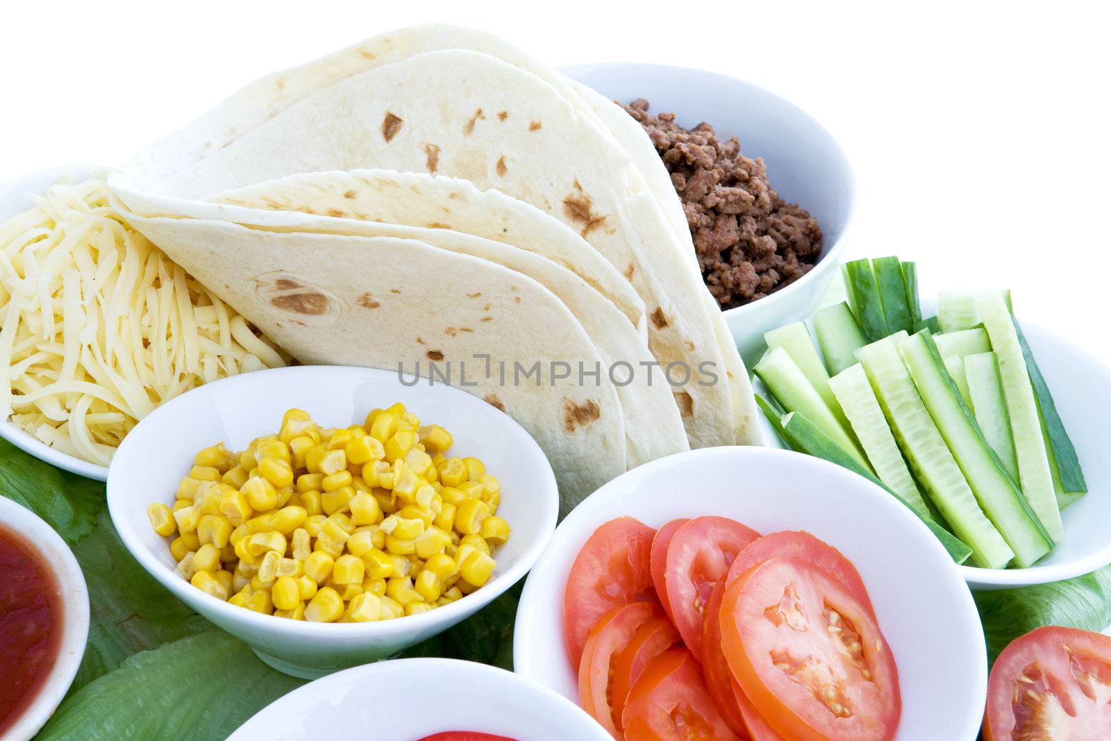 A layout of taco ingredients isolated on white