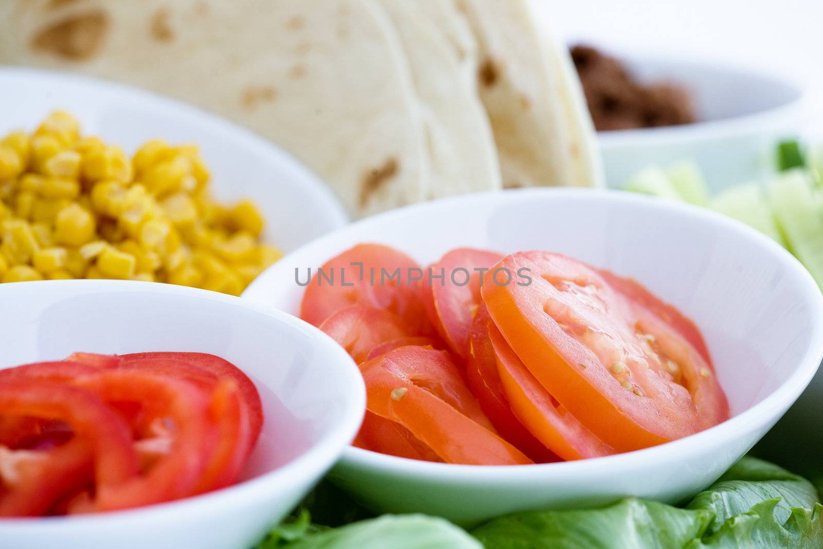 Taco ingredients - shallow depth of field with focus on the tomatoes
