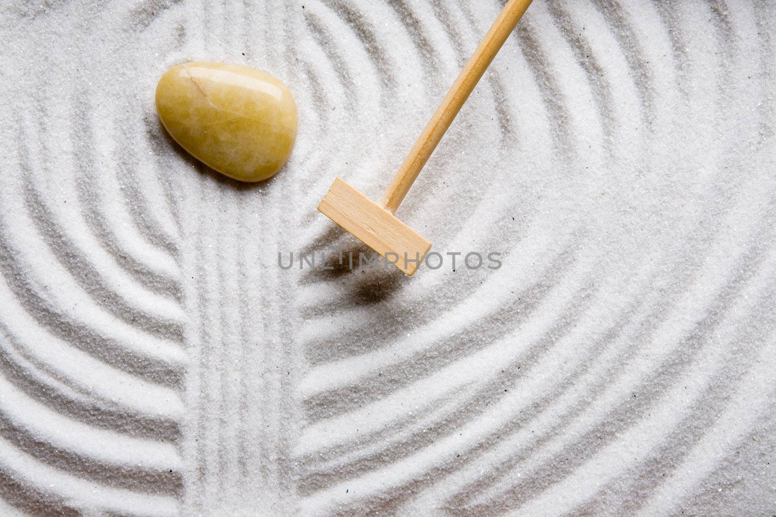 A rake in a zen rock garden, preparing the sand