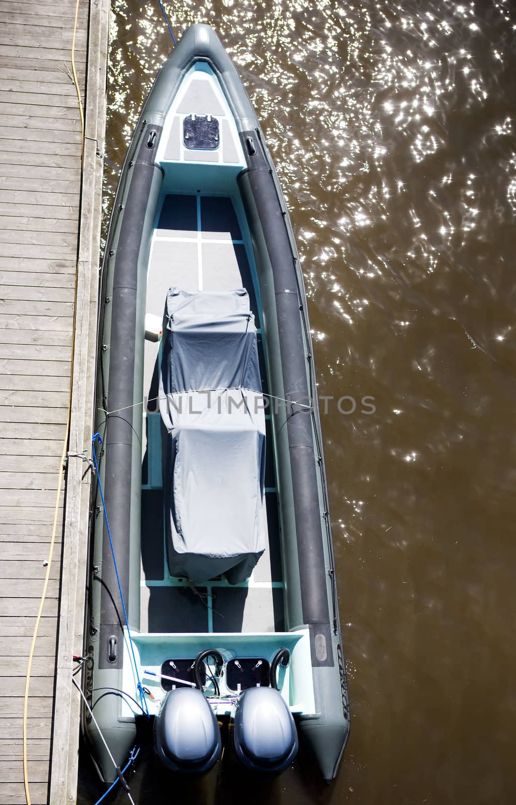 A top view of a speed boat at dock