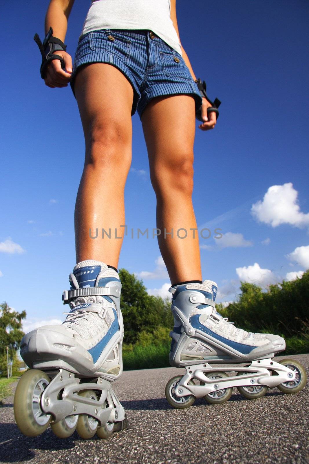 Inline skates. closeup of woman legs and skates.