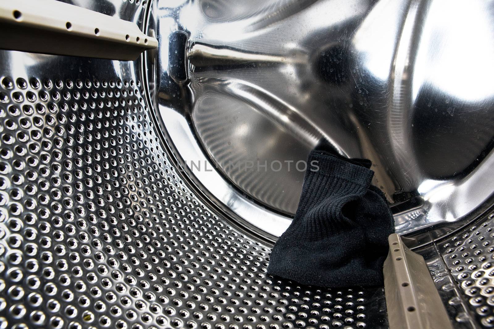 A single sock in a washing machine.