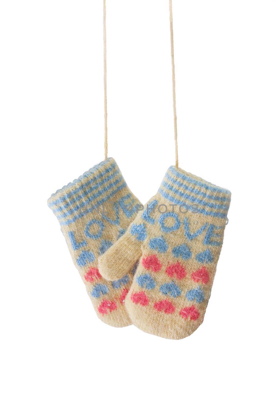 Hanging baby mittens isolated on white background