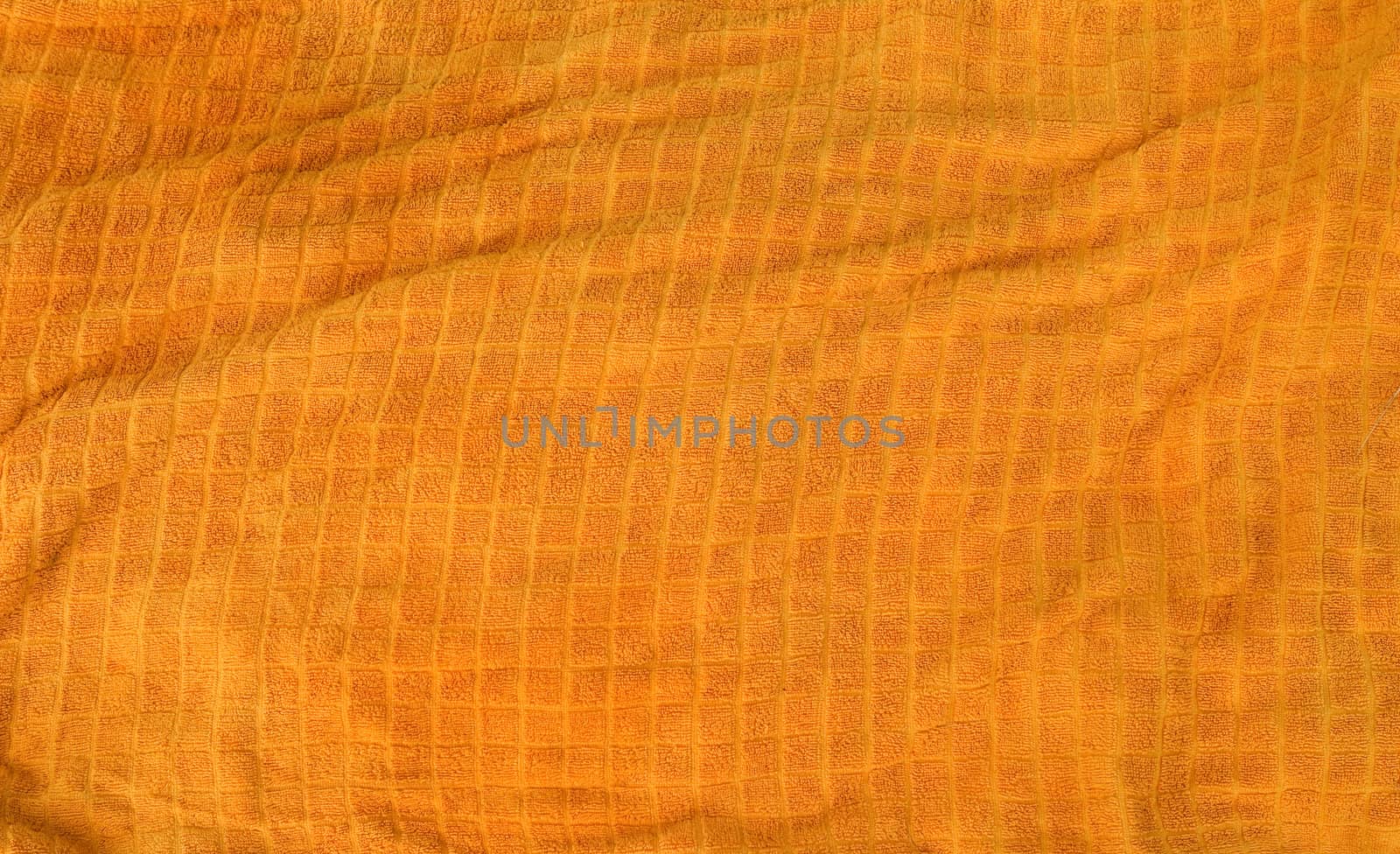 A bright orange cloth towl background texture