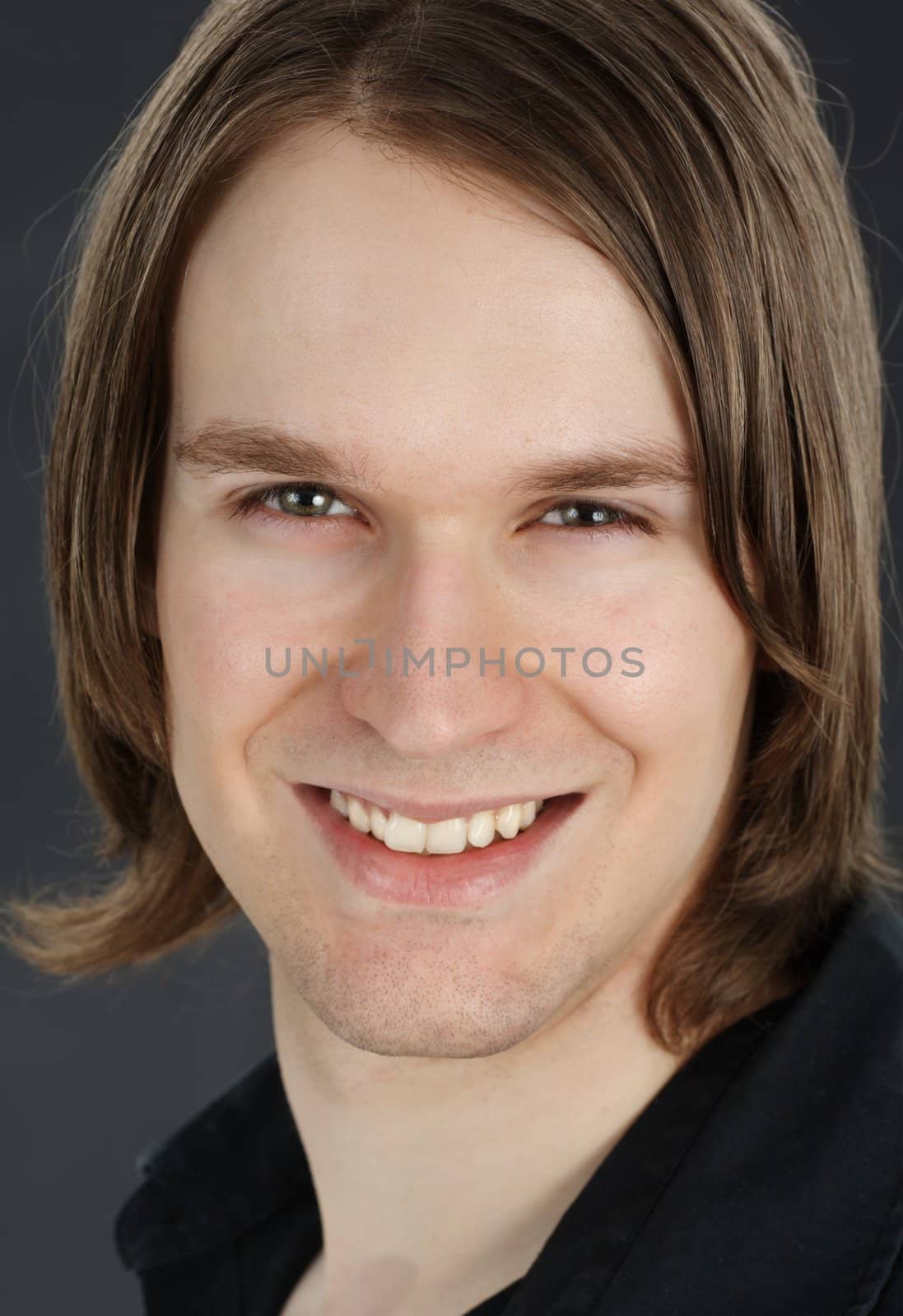 closeup portrait of young man, smiling, isolated on white