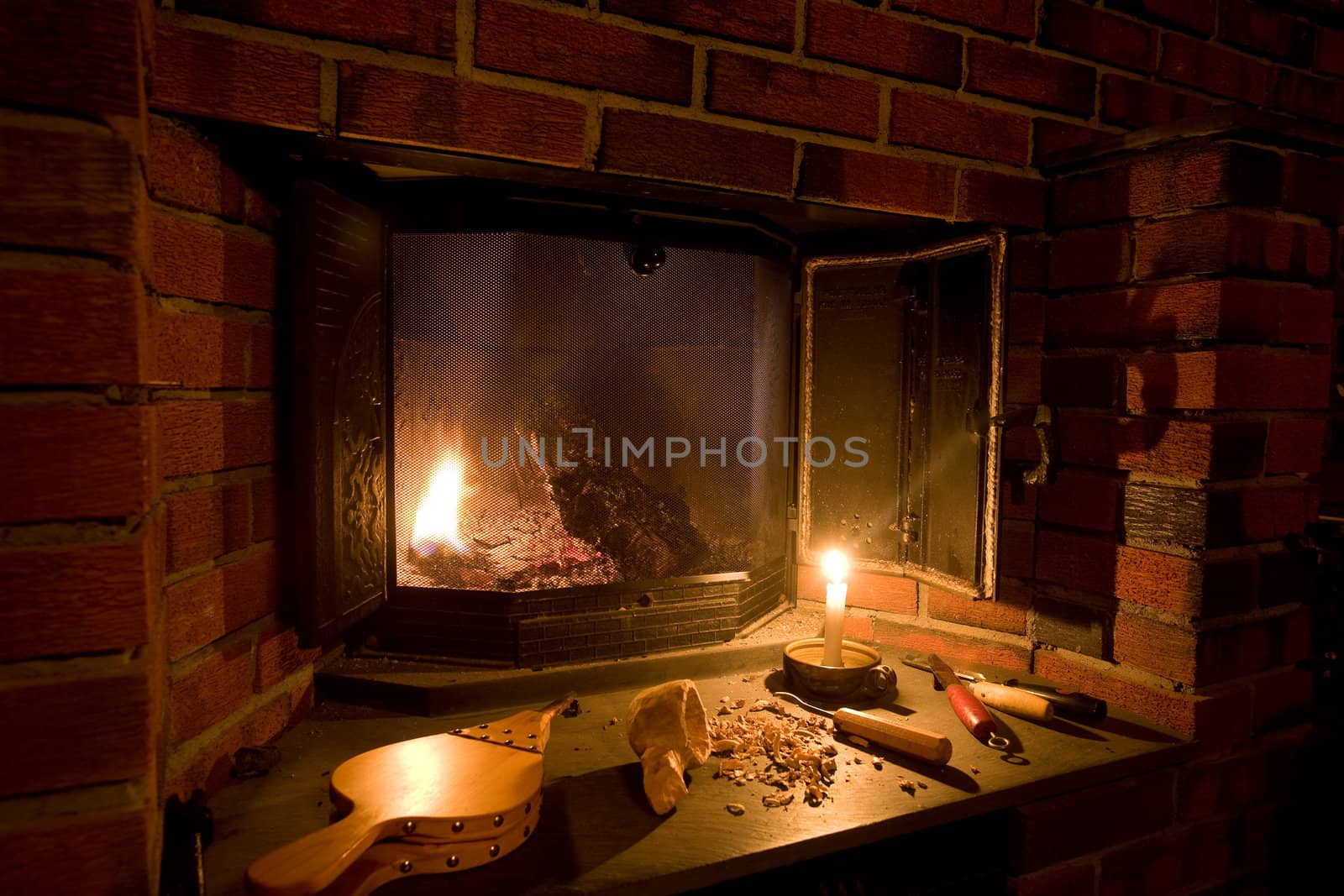 A fireplace scene in an old fashioned setting