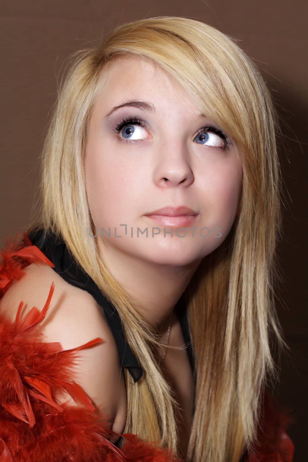 Blond teen girl with red feather boa