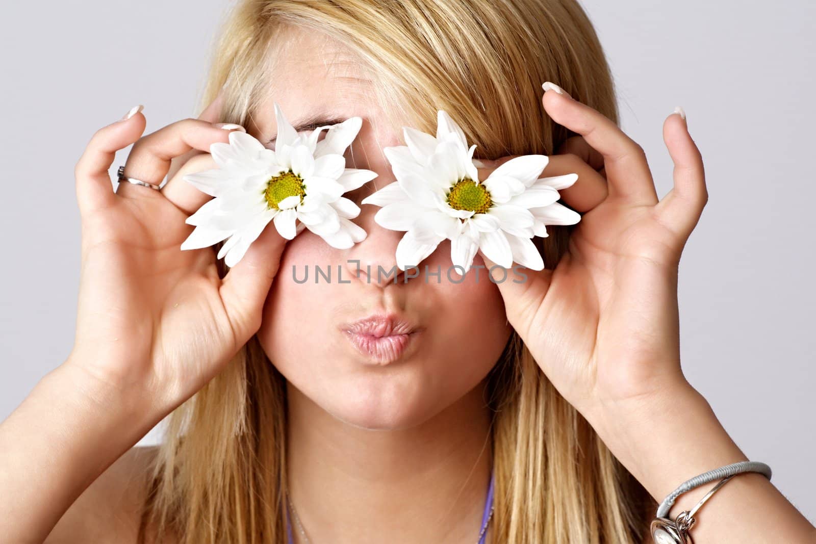 blond teen girl with daisies on front of her eyes