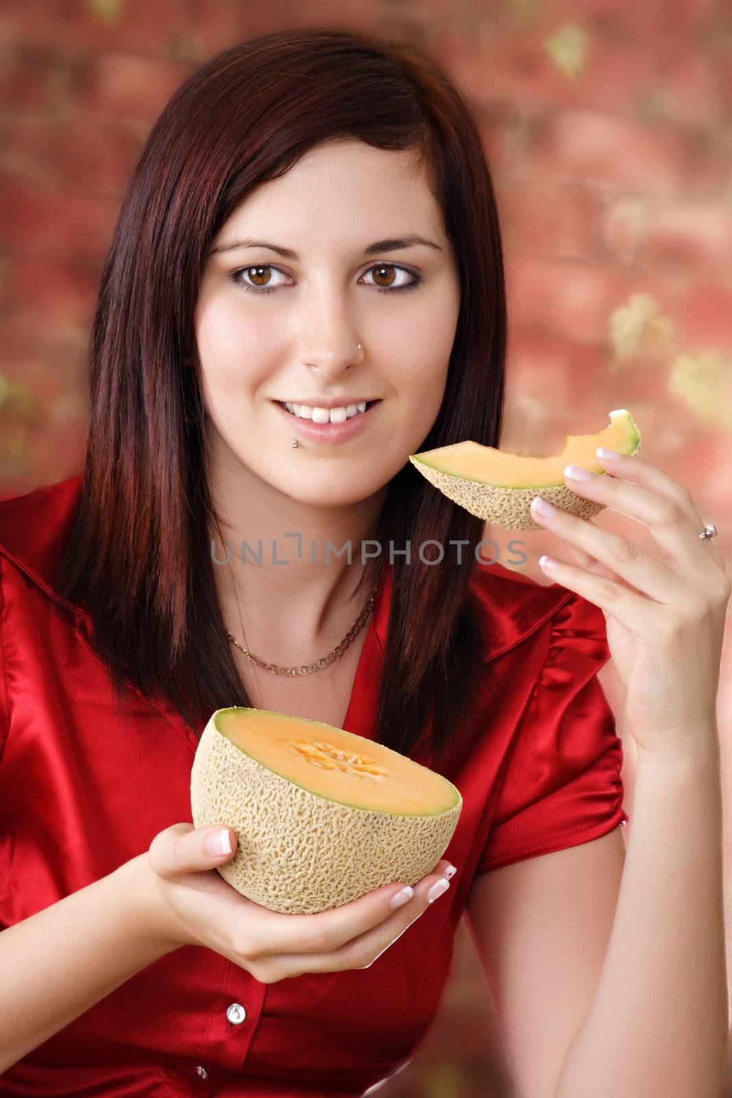 young woman with a piece of cantaloup