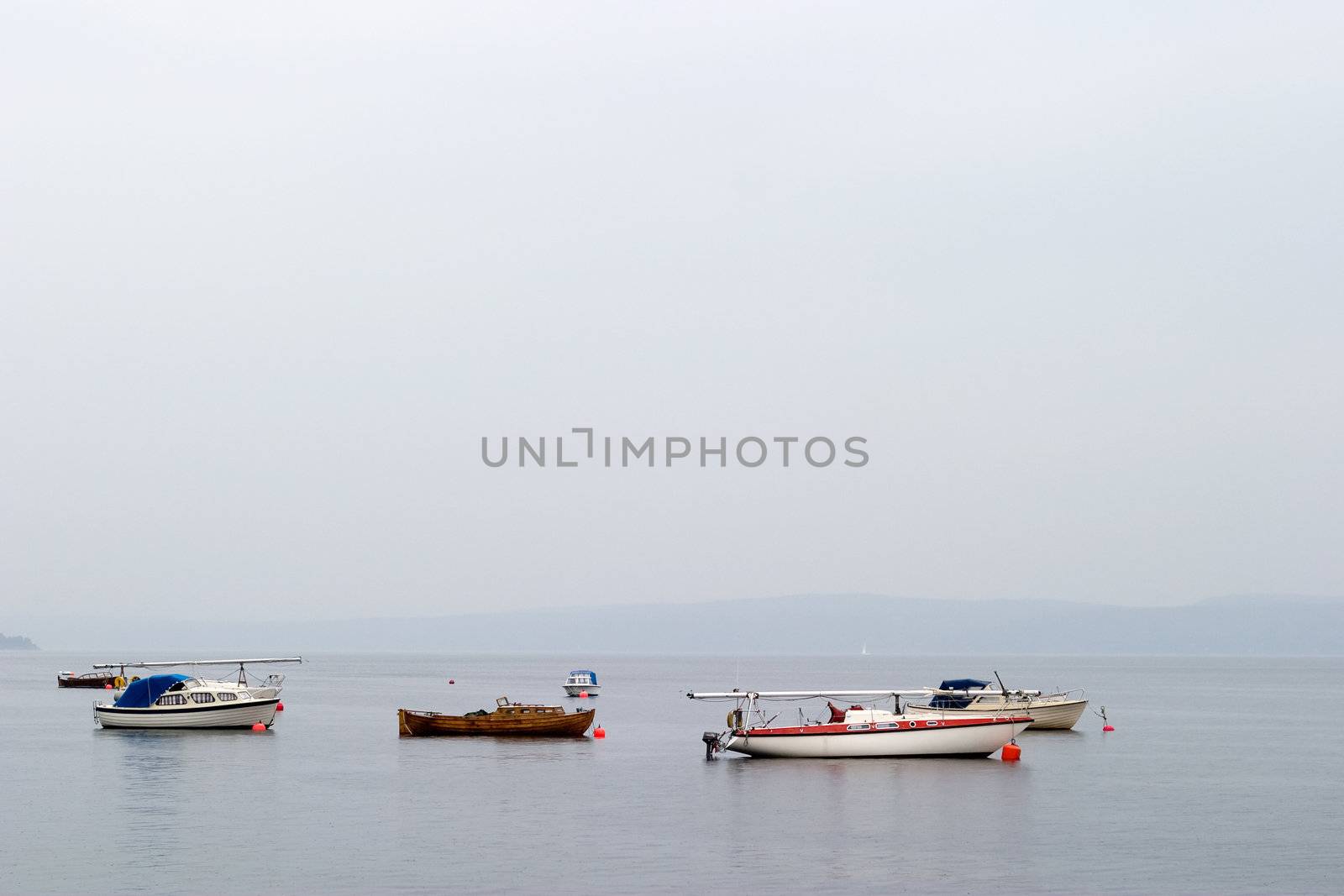 Oslo fjord with sail boats in the mist