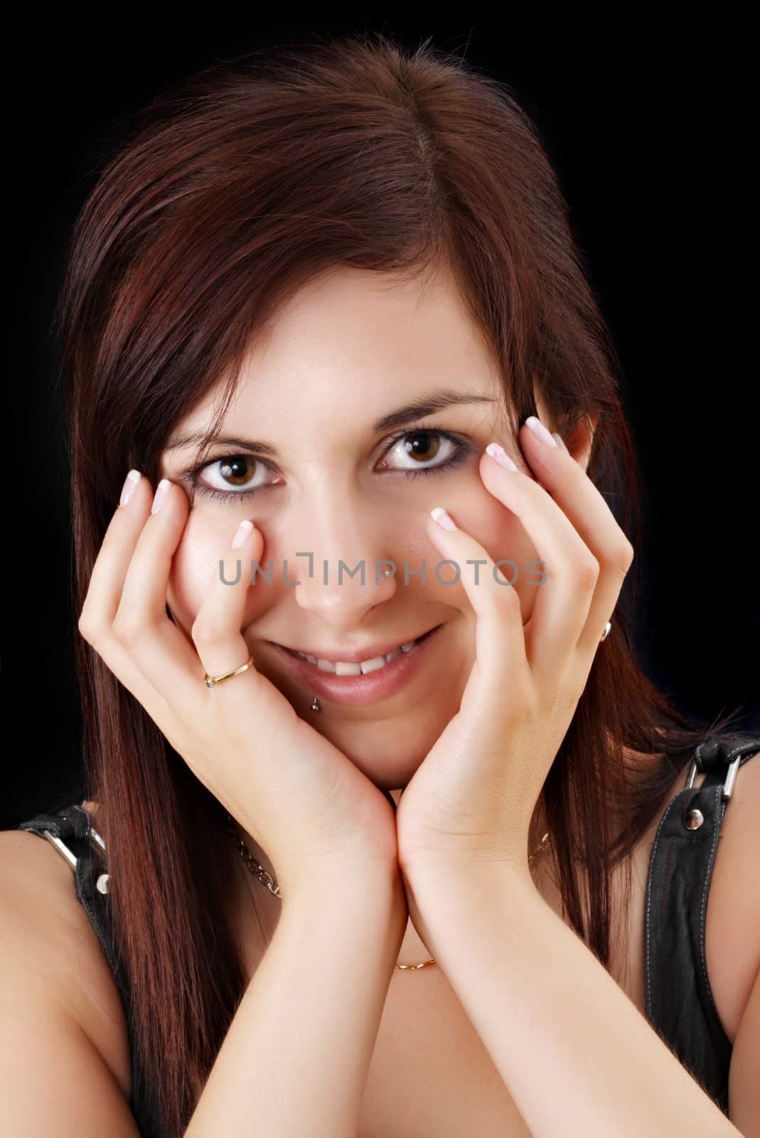 portrait of a young woman with hands on her face