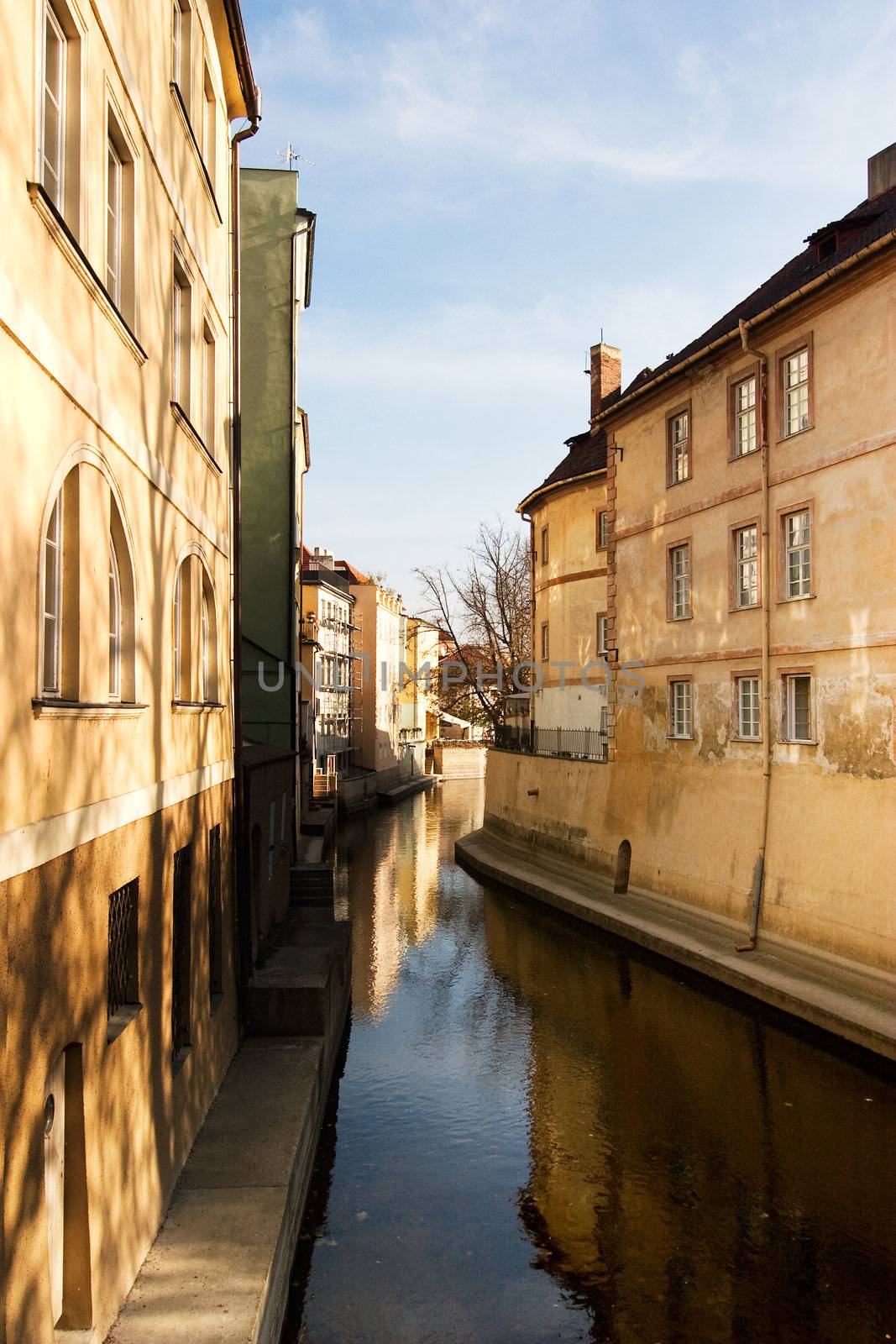 A small river flowing through the old town area of Prague, Czech Republic.