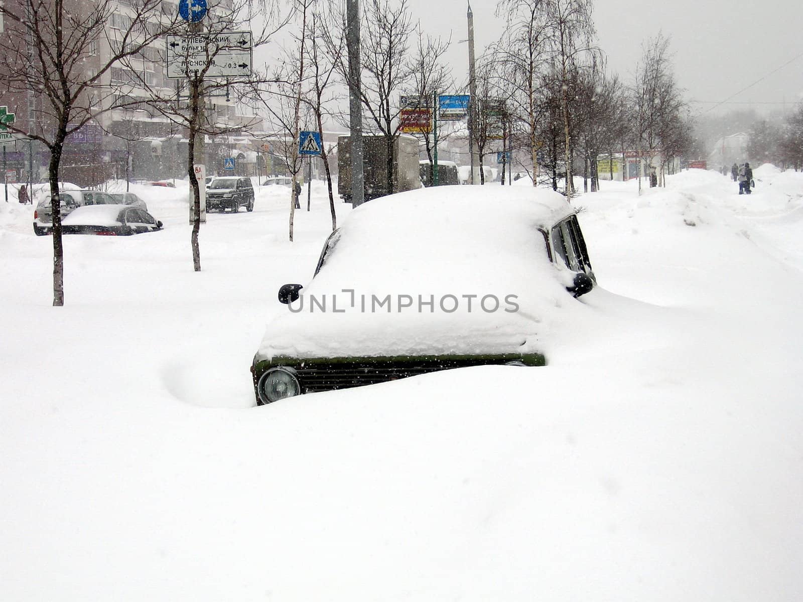 Car with a pile of snow on the top