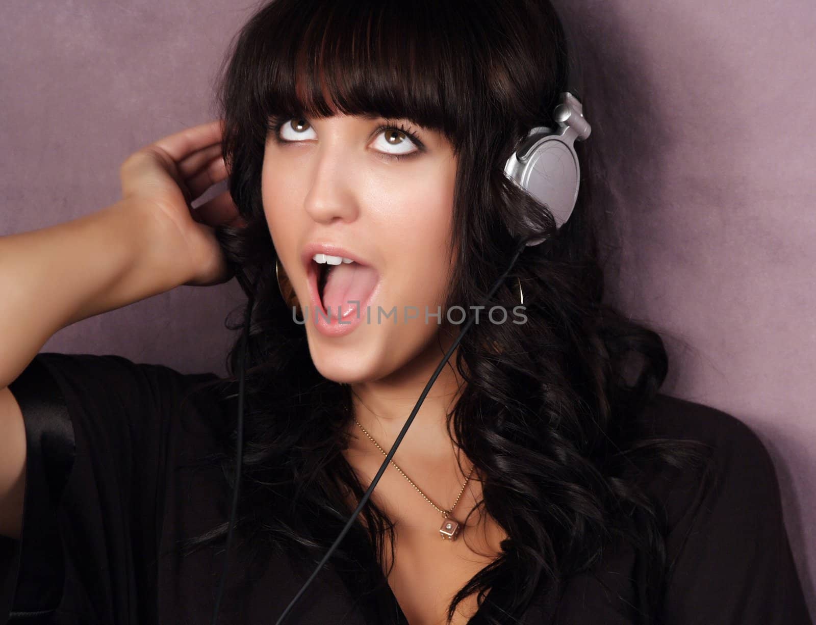 portrait of a young pretty woman listening music