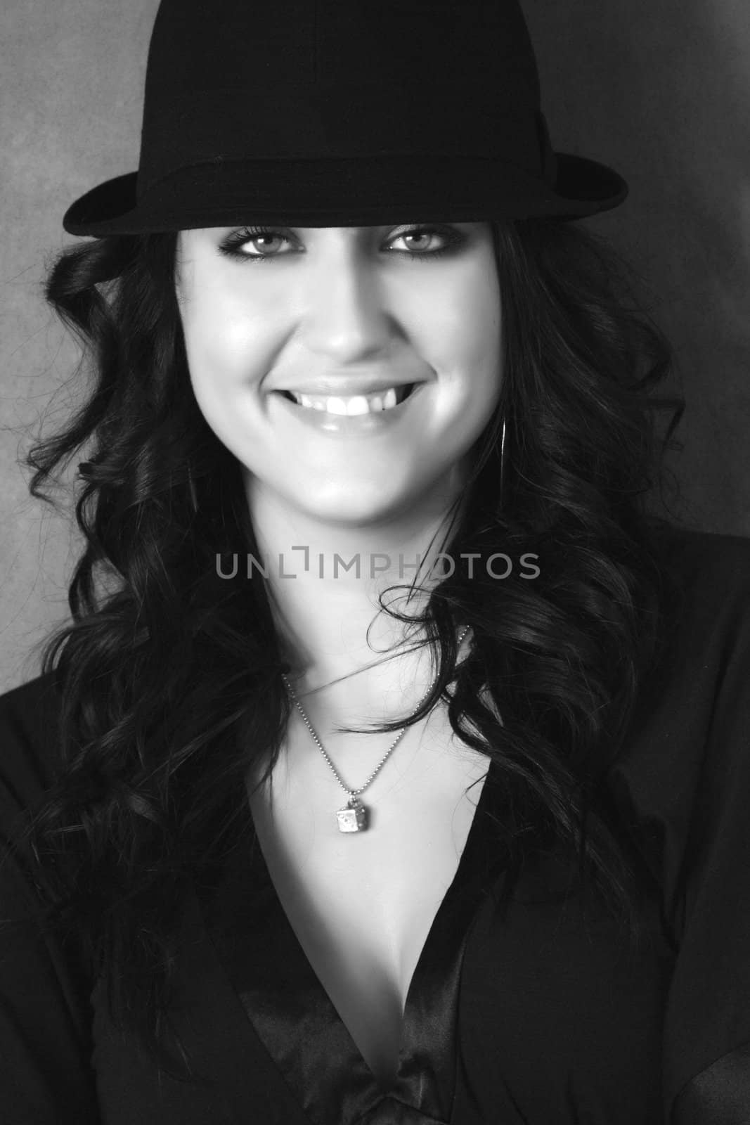 portrait of a young pretty woman with a hat