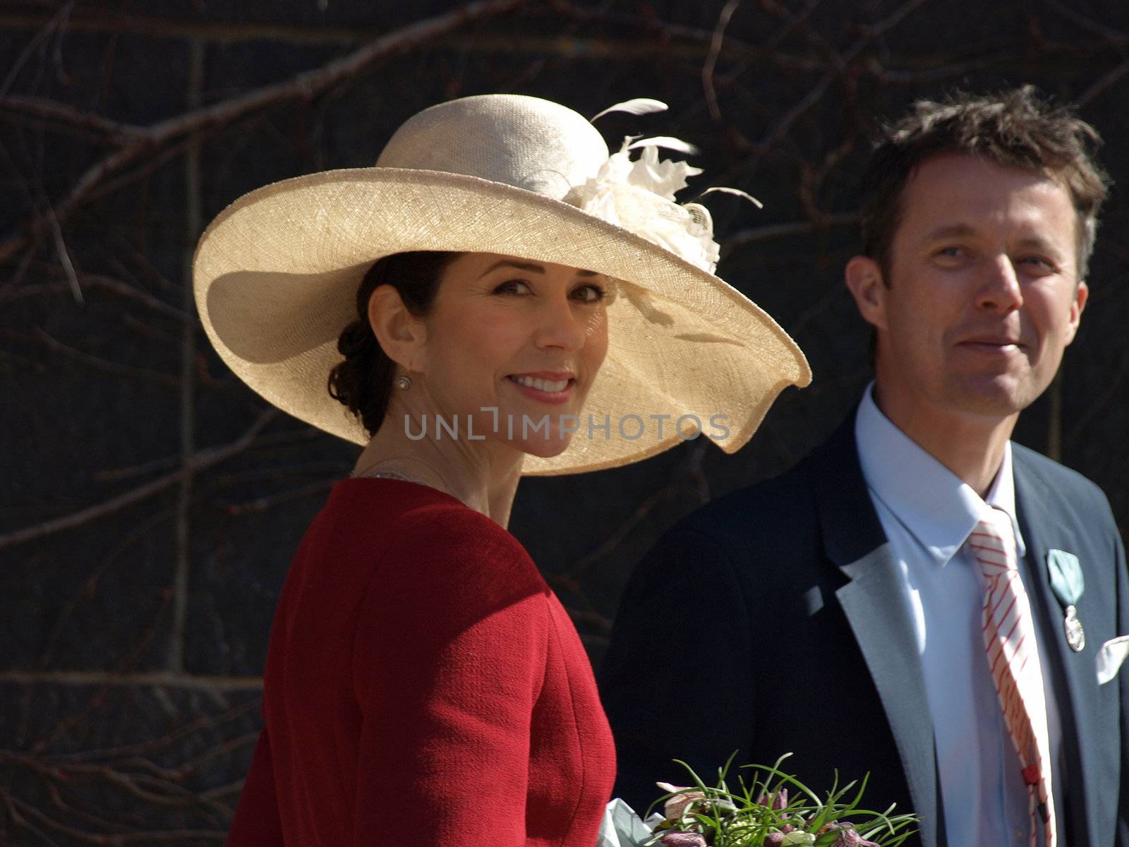 COPENHAGEN - APR 16: HRH Crown Prince Frederik and Princess Mary smile at the crowd infront of the Copenhagen City Hall during the celebration of Queen Margrethe's 70th birthday on April 16, 2010.

