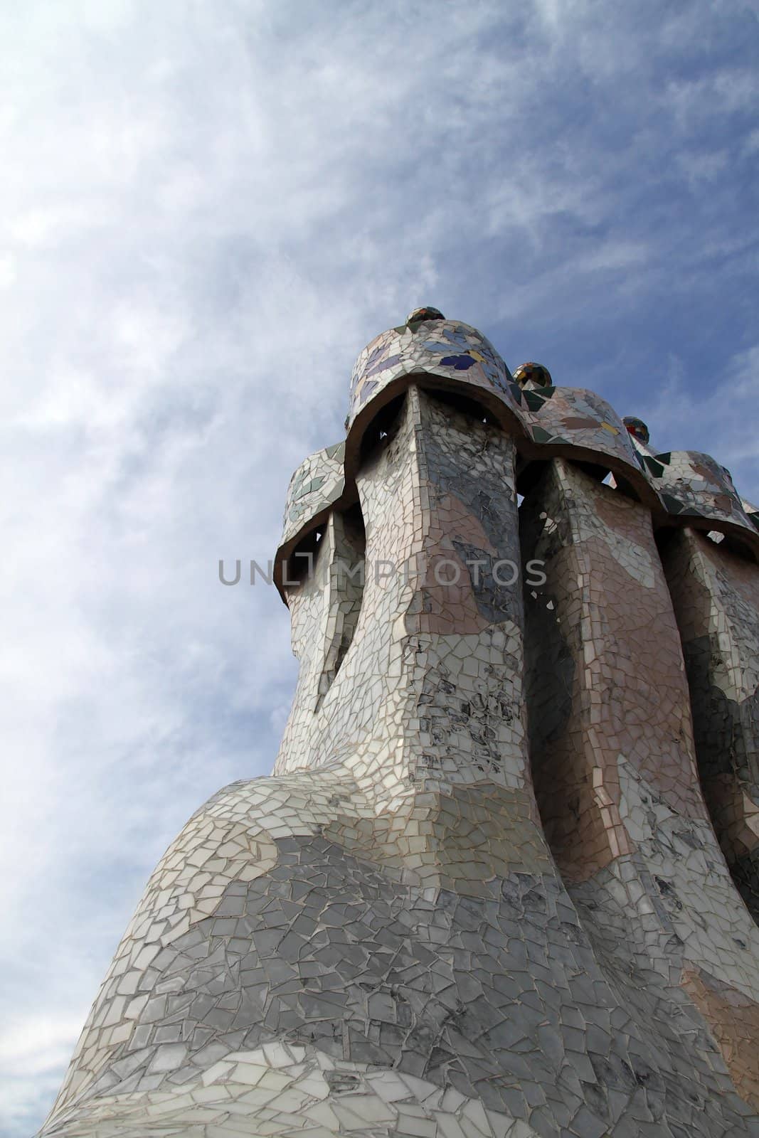 Chimney smoke stacks clustered together with tiles coving them