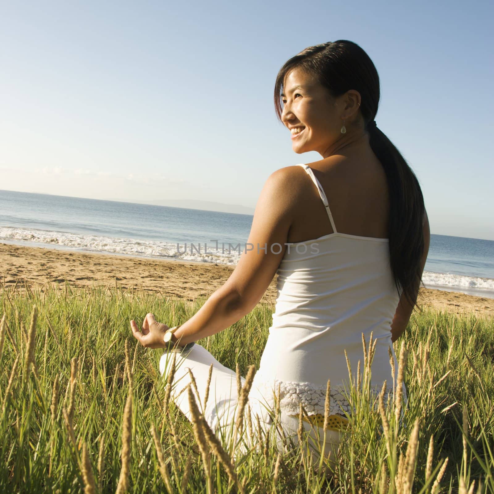 Woman meditating. by iofoto