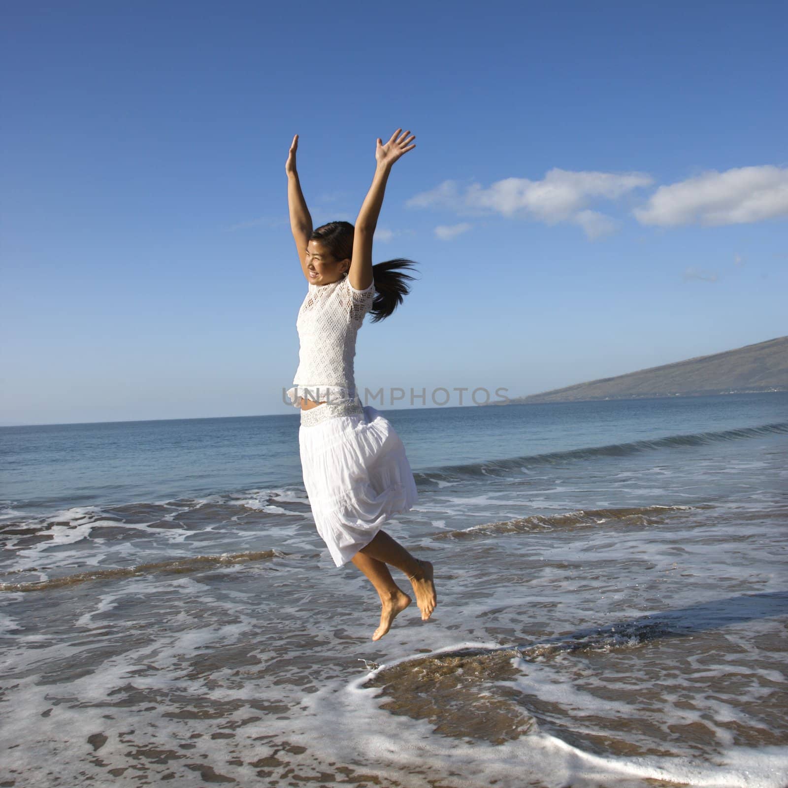 Woman jumping. by iofoto