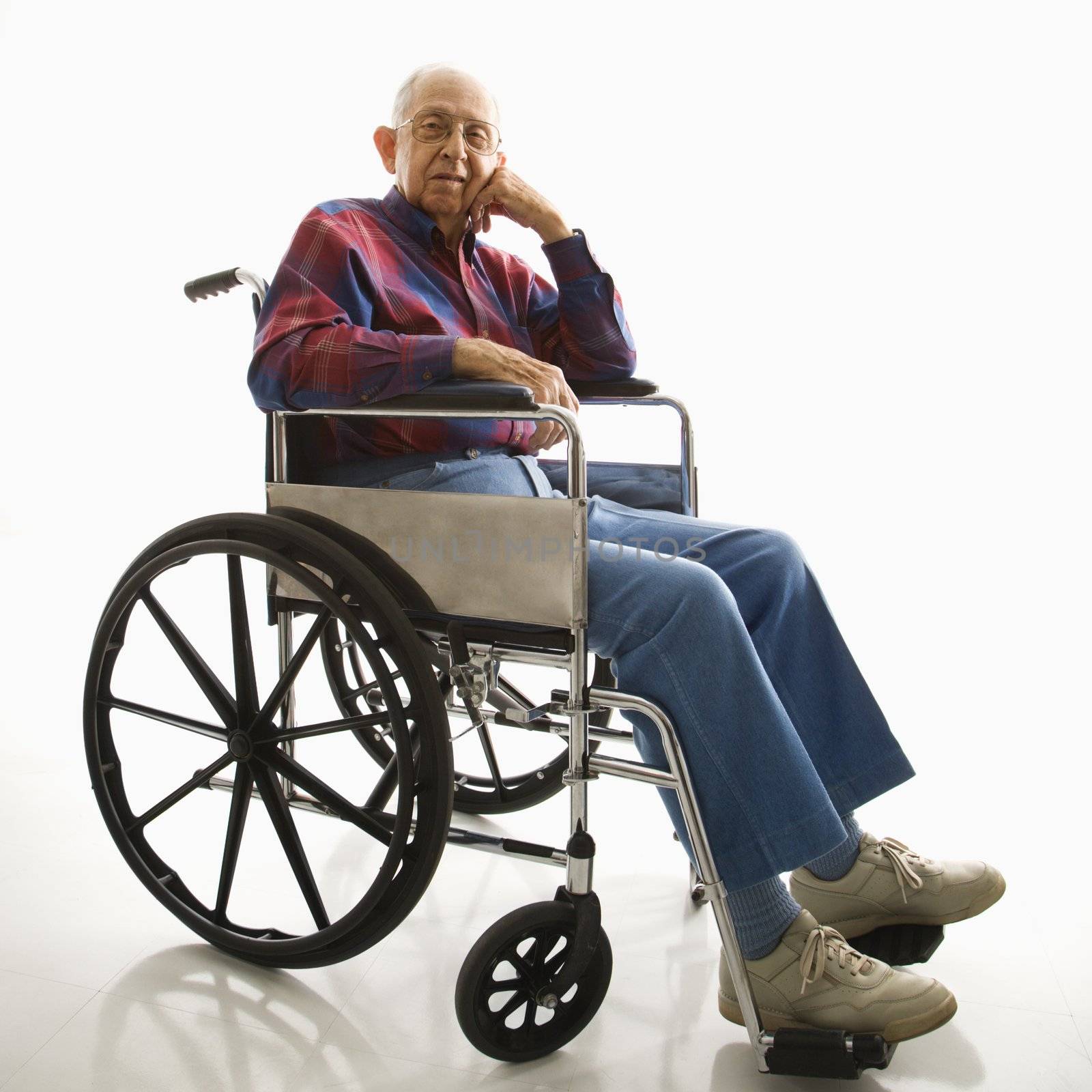 Elderly man in wheelchair. by iofoto