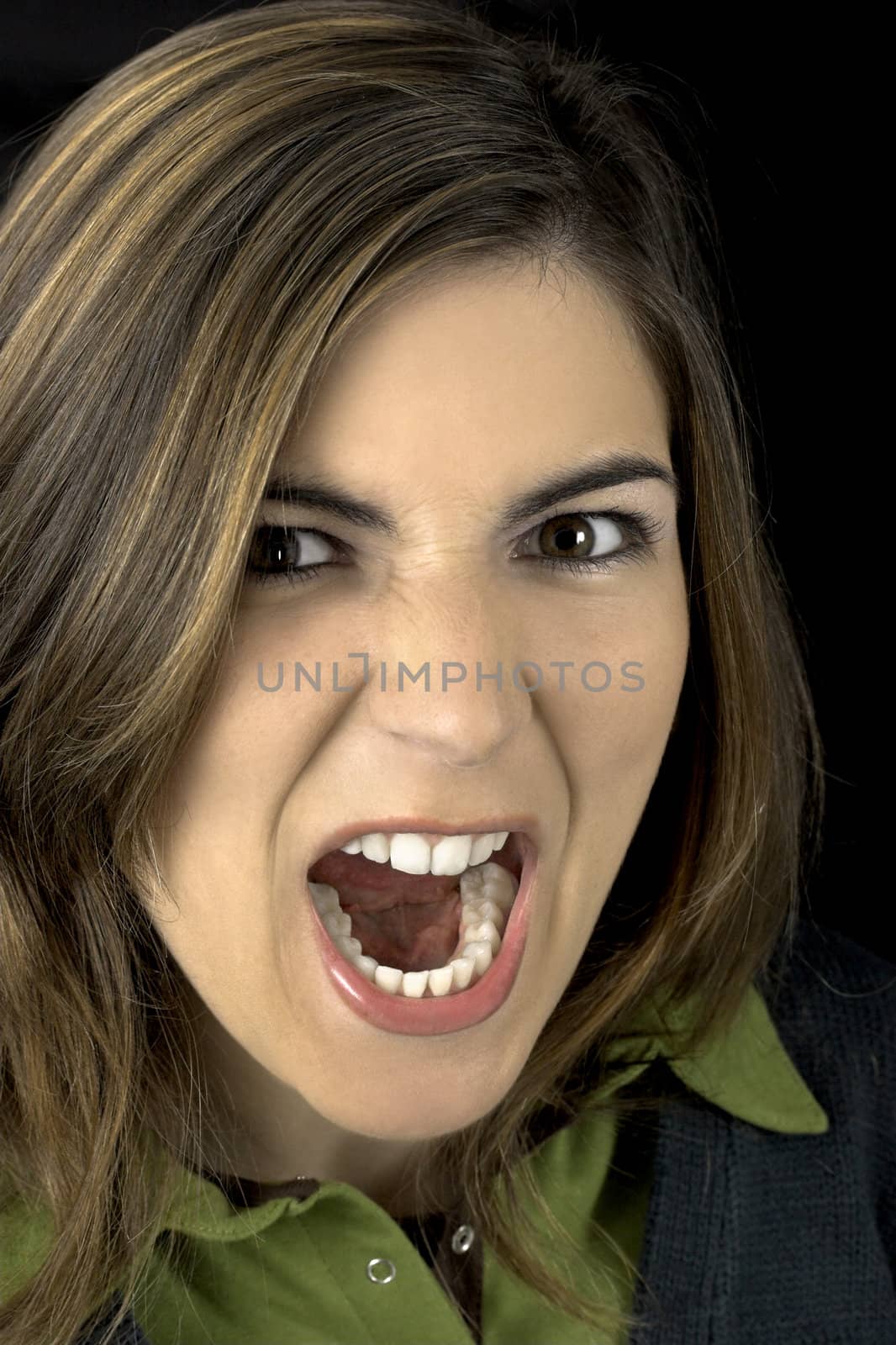 Portrait of a young atractive woman yelling