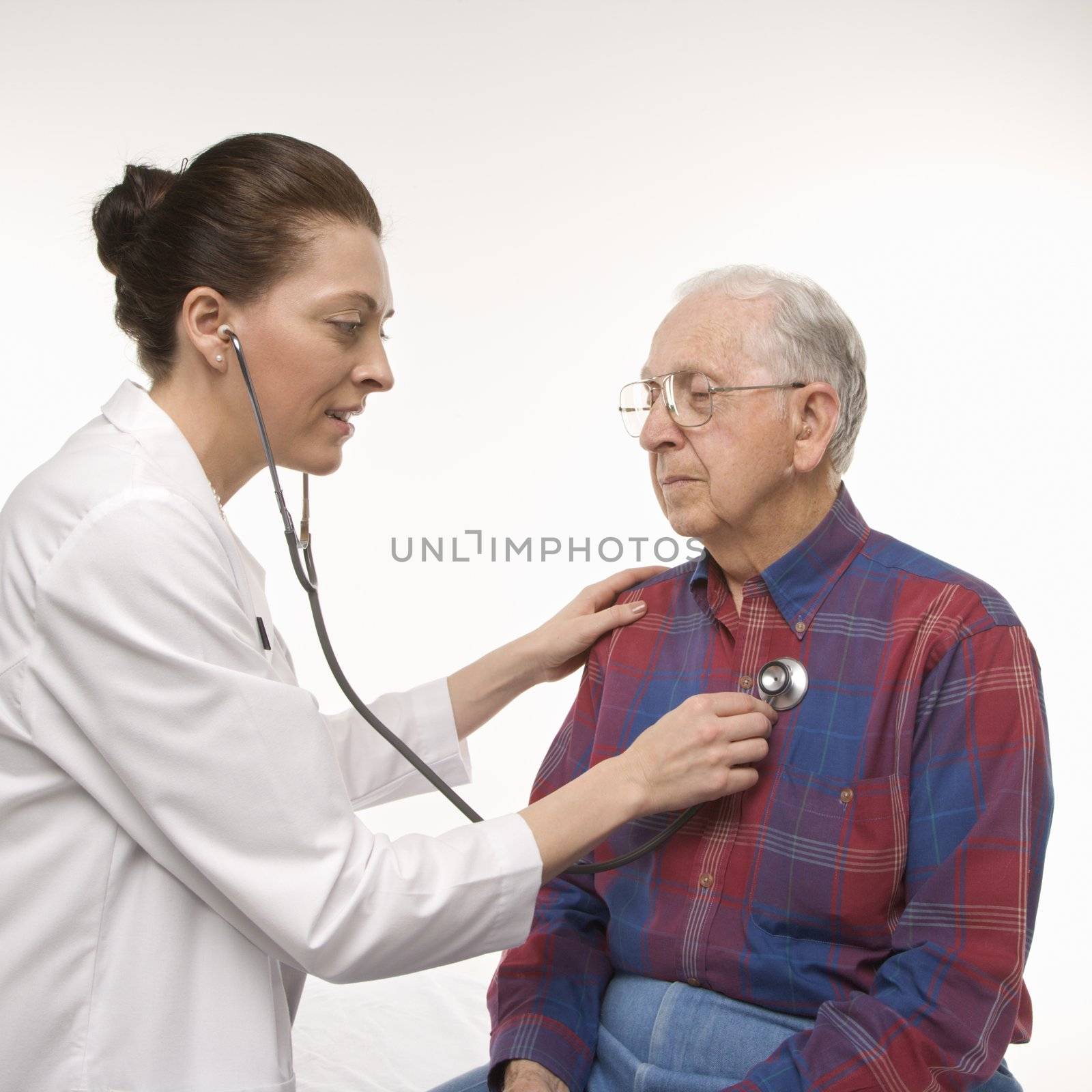 Man getting medical exam. by iofoto